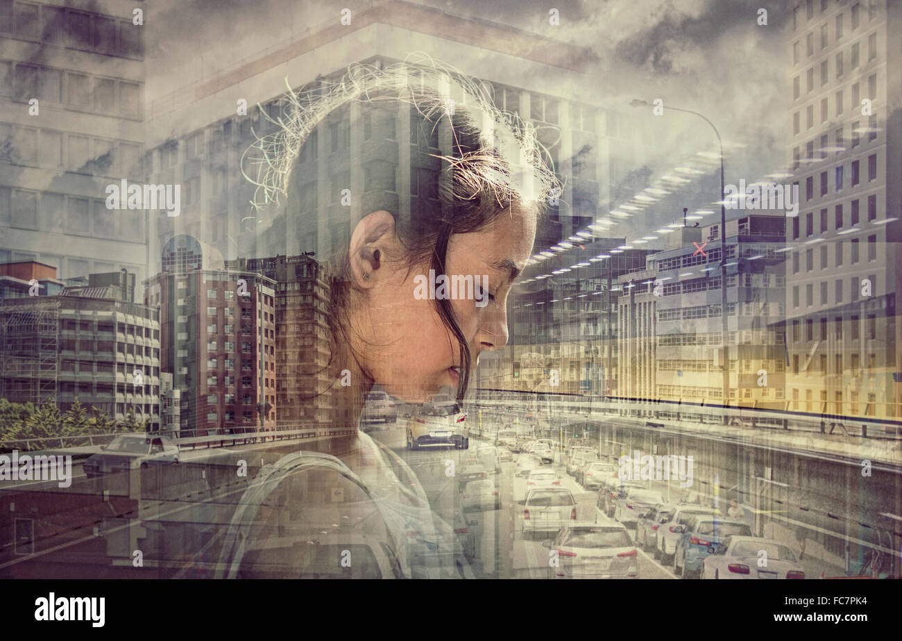 Double exposure of mixed race girl and busy cityscape Stock Photo
