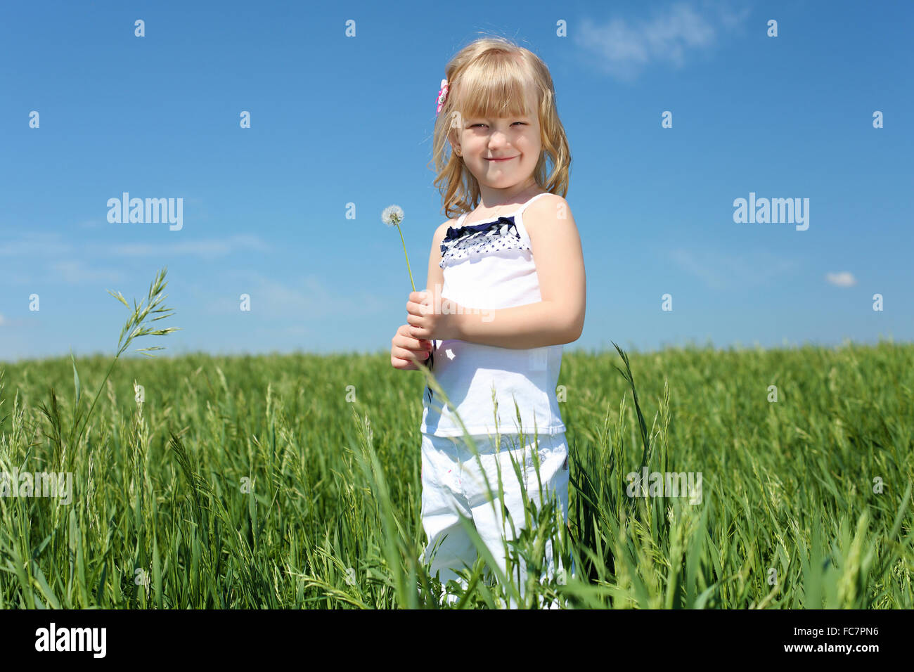 little girl outdoors in sunny summer day Stock Photo - Alamy