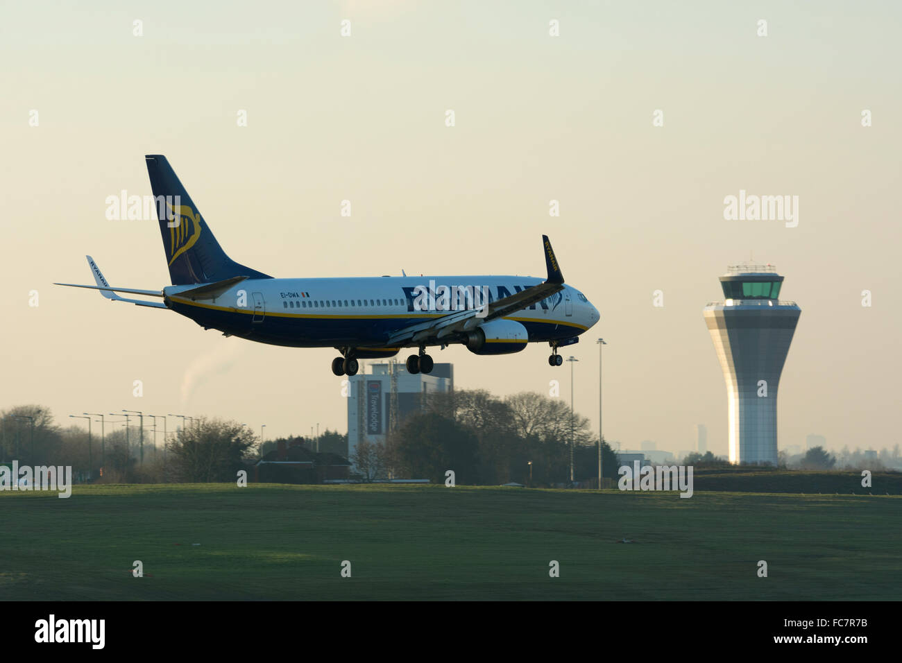 Ryanair Boeing 737 landing at Birmingham Airport at dusk, UK (EI-DWA) Stock Photo