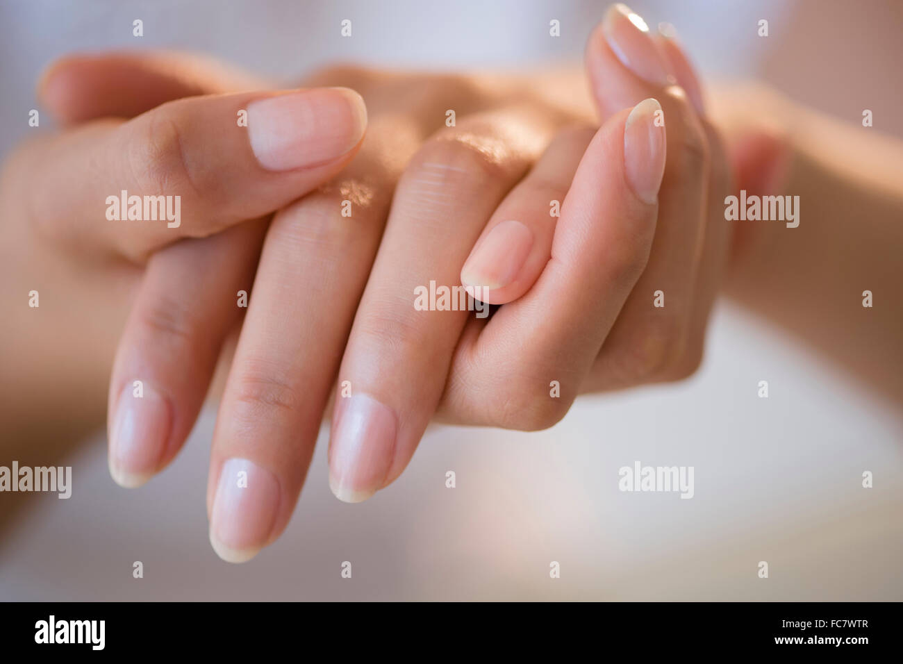 Close up of hands of Hispanic woman Stock Photo