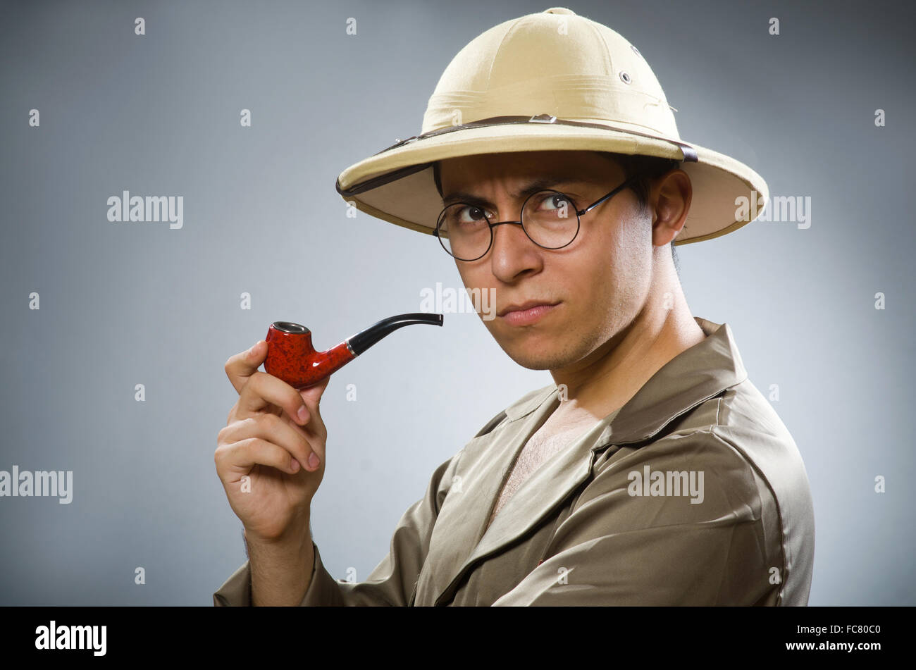 Man wearing safari hat in funny concept Stock Photo - Alamy