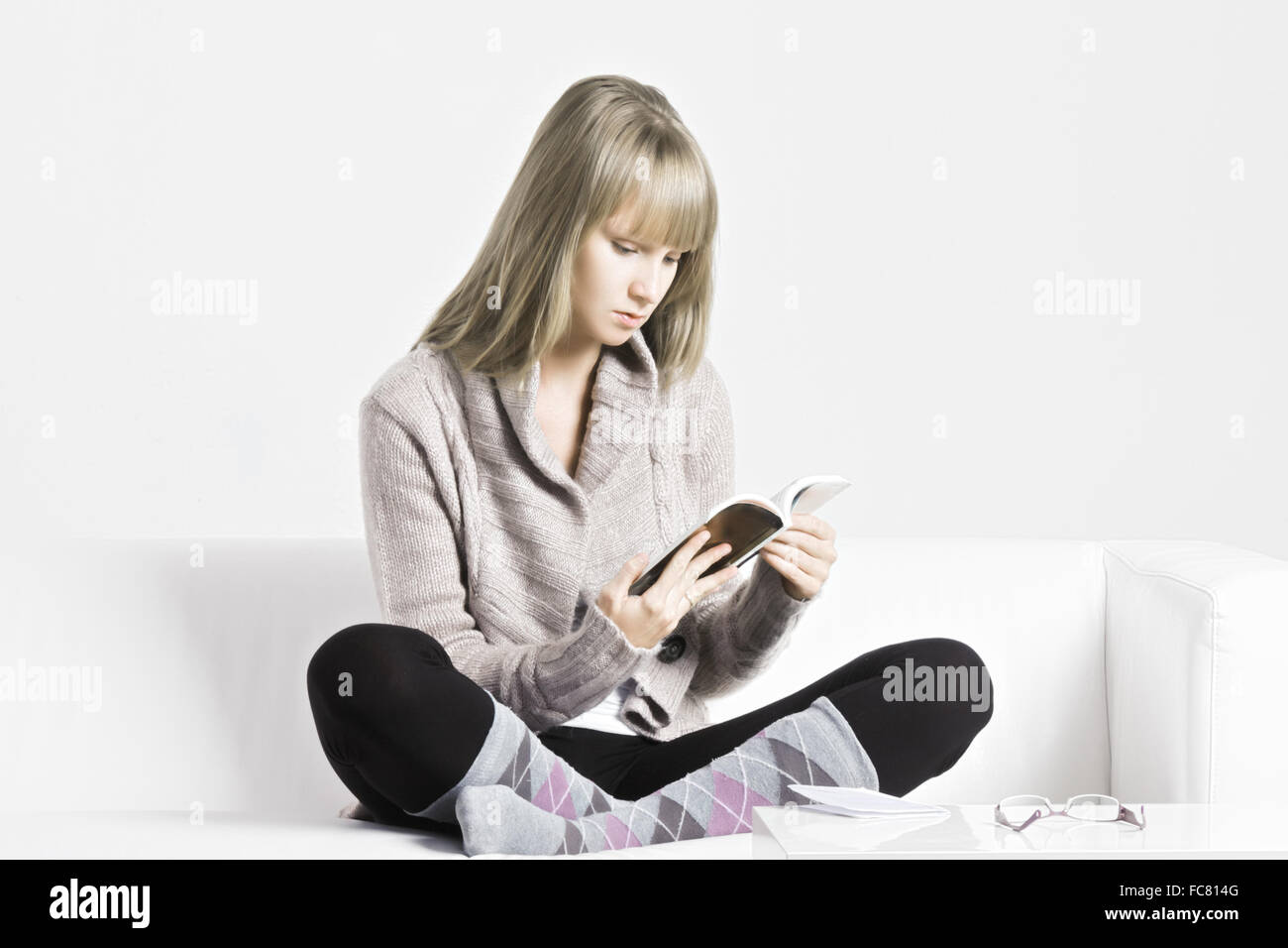 Blonde woman reading Stock Photo