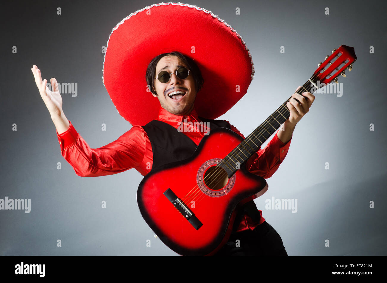 Mexican guitar player in red Stock Photo Alamy