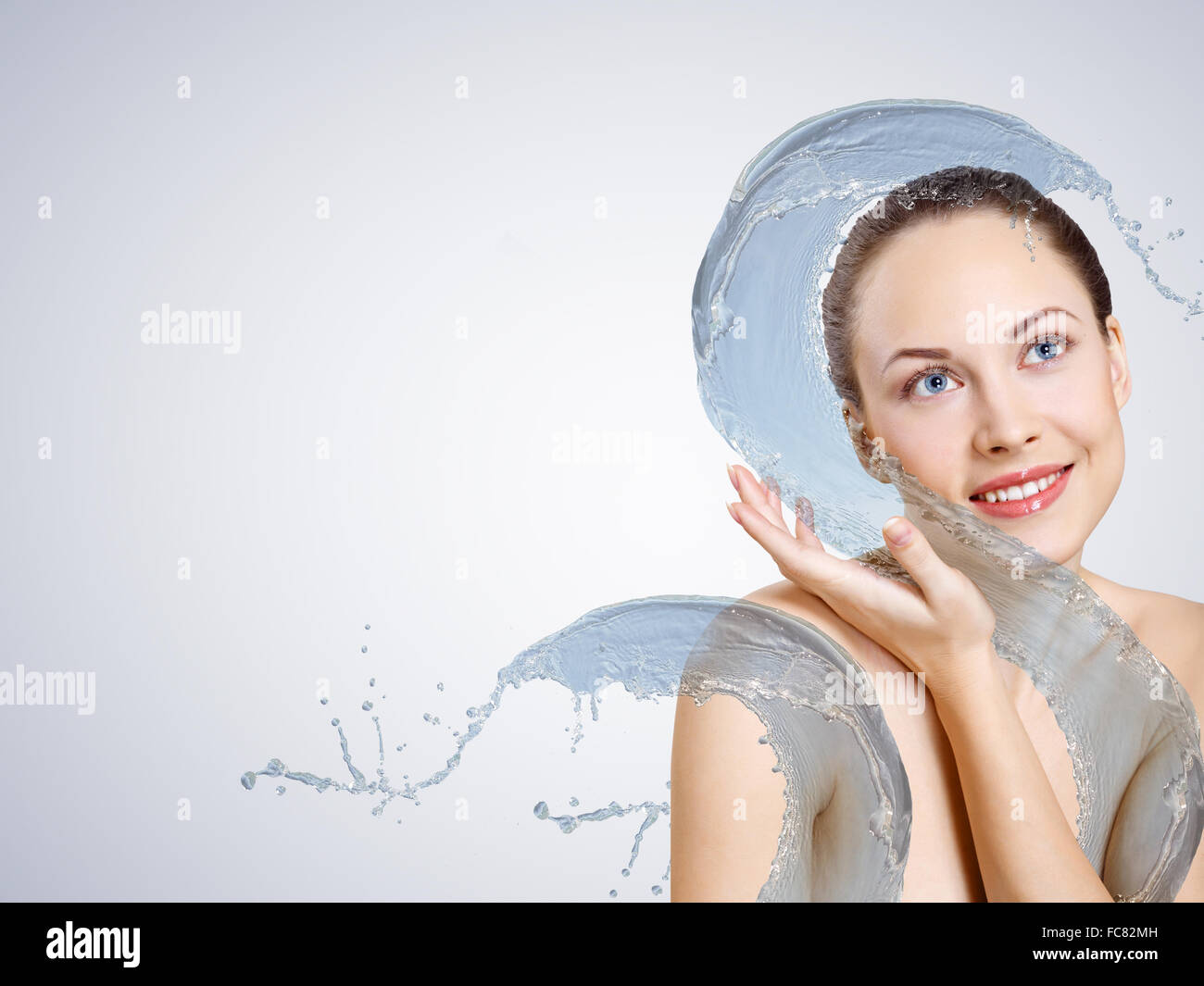 Portrait of beautiful young woman with water splashes Stock Photo - Alamy