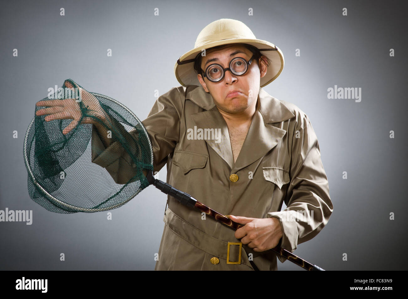 Man wearing safari hat in funny concept Stock Photo - Alamy