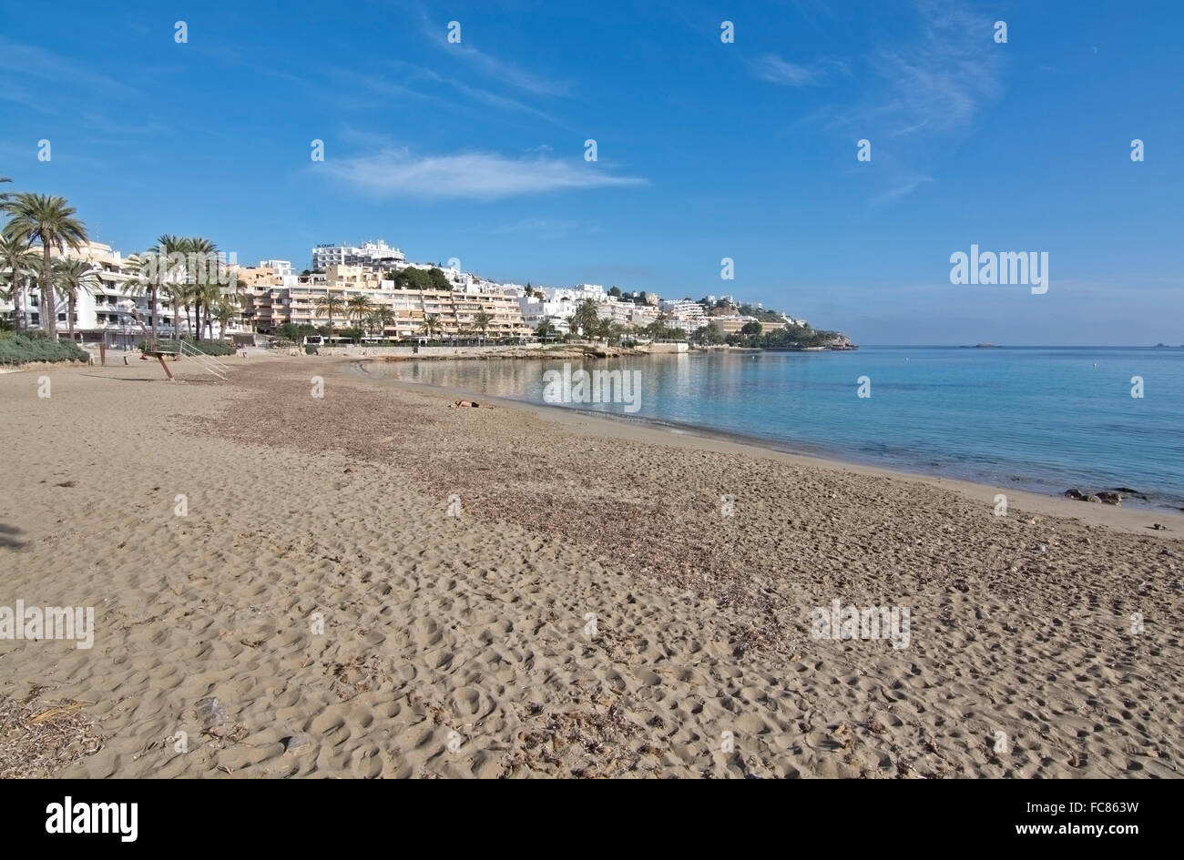 Empty beautiful sandy Playa d'en Bossa beach on a sunny morning in December, Ibiza, Spain. Stock Photo