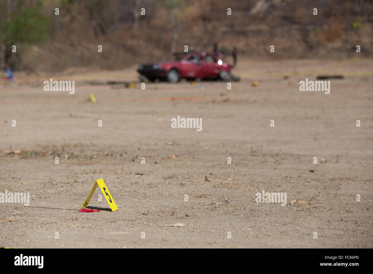 yellow evidence number tag in car bomb crime scene Stock Photo