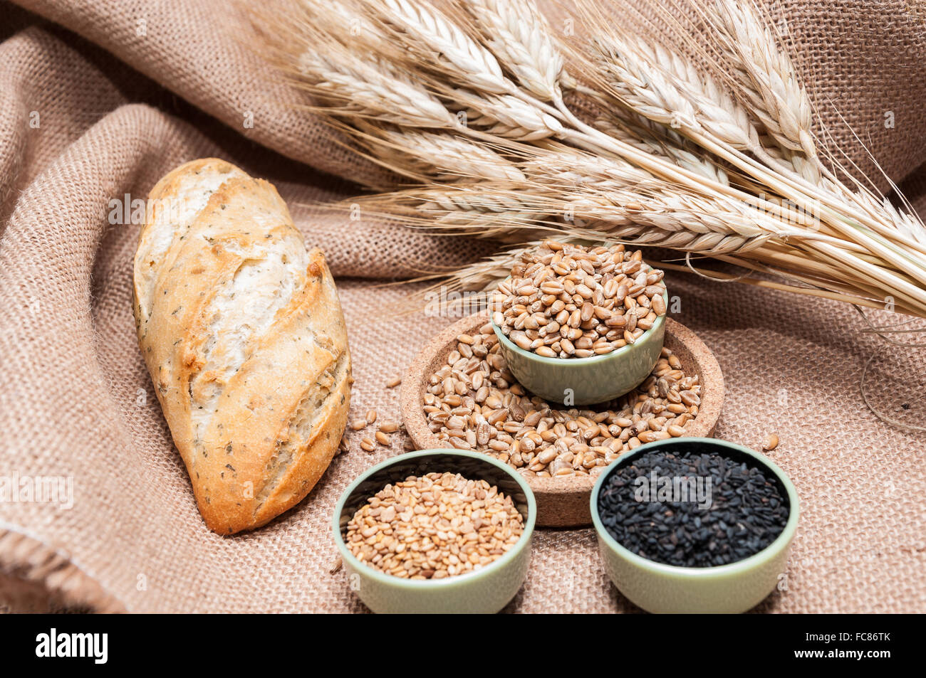 Bread, sesame seeds and wheat grains Stock Photo Alamy