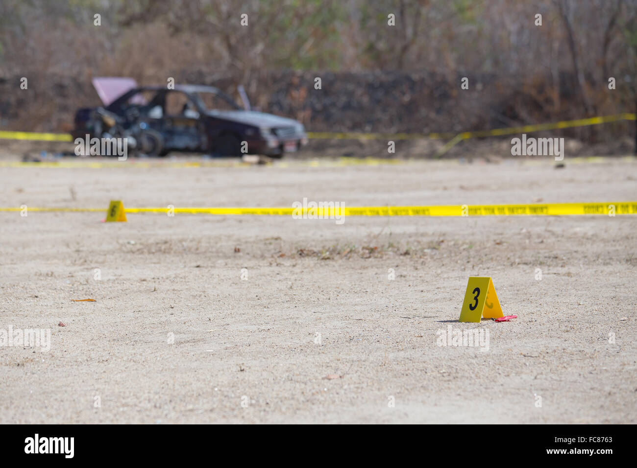 yellow evidence number tag in car bomb crime scene Stock Photo