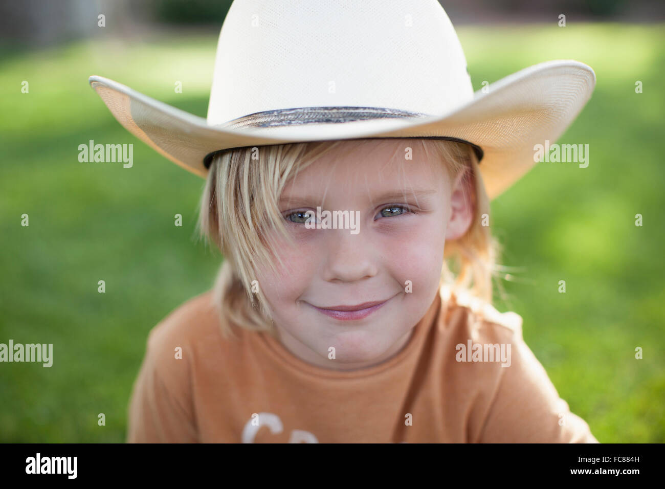 Caucasian boy in cowboy hat Stock Photo Alamy