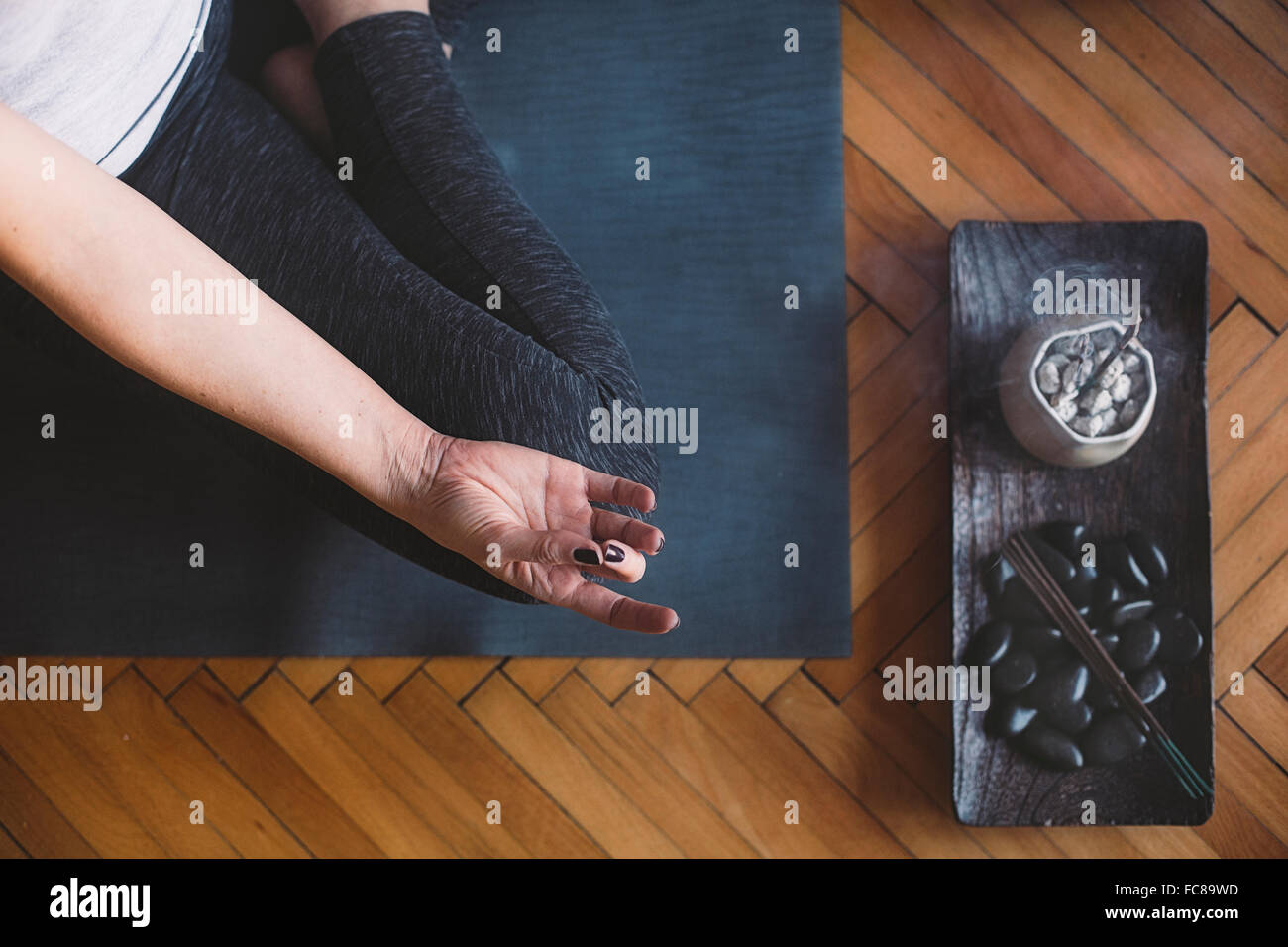 Caucasian woman meditating in yoga studio Stock Photo - Alamy