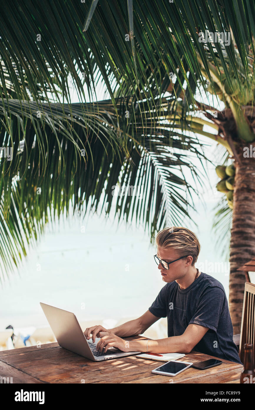 Asian man tourist using laptop hi-res stock photography and images - Alamy