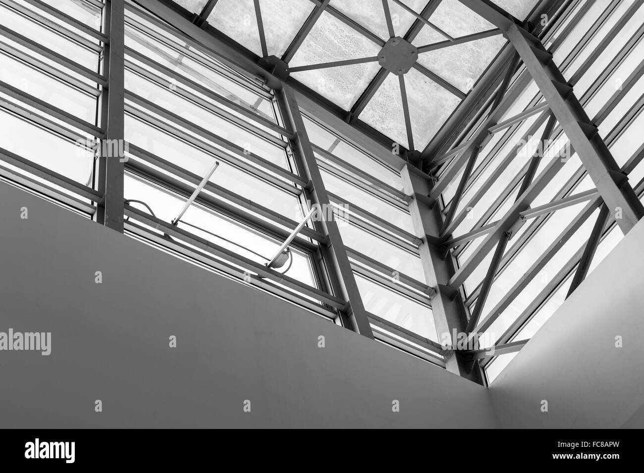 Abstract style roofing detail interior of a modern building with glass panels in black and white Stock Photo