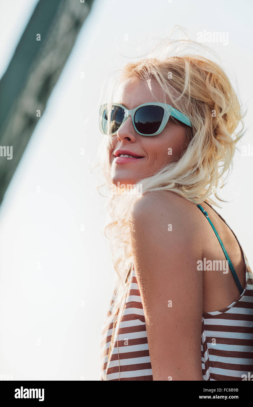 Caucasian woman in sunglasses outdoors Stock Photo