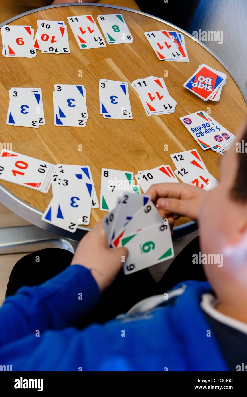 Two boys playing cards Stock Photo Alamy