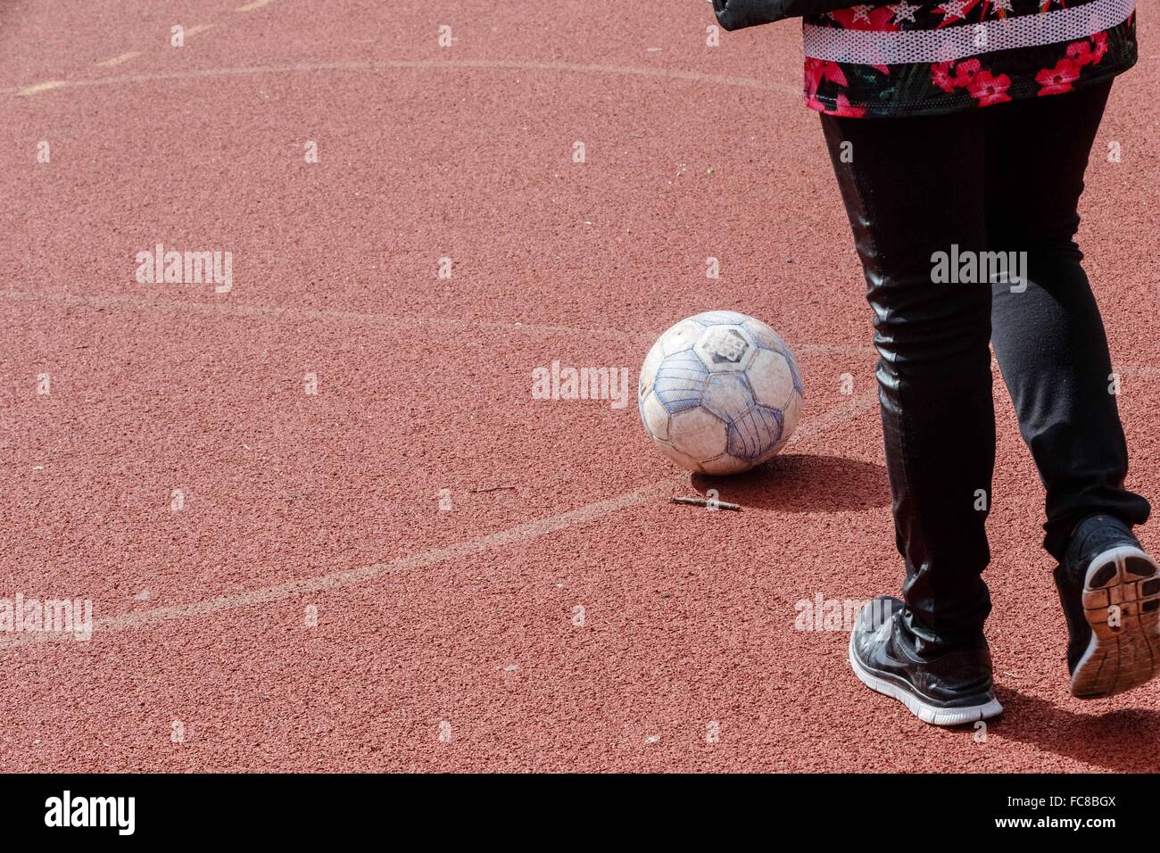 A girl shooting at a soccer goal Stock Photo Alamy