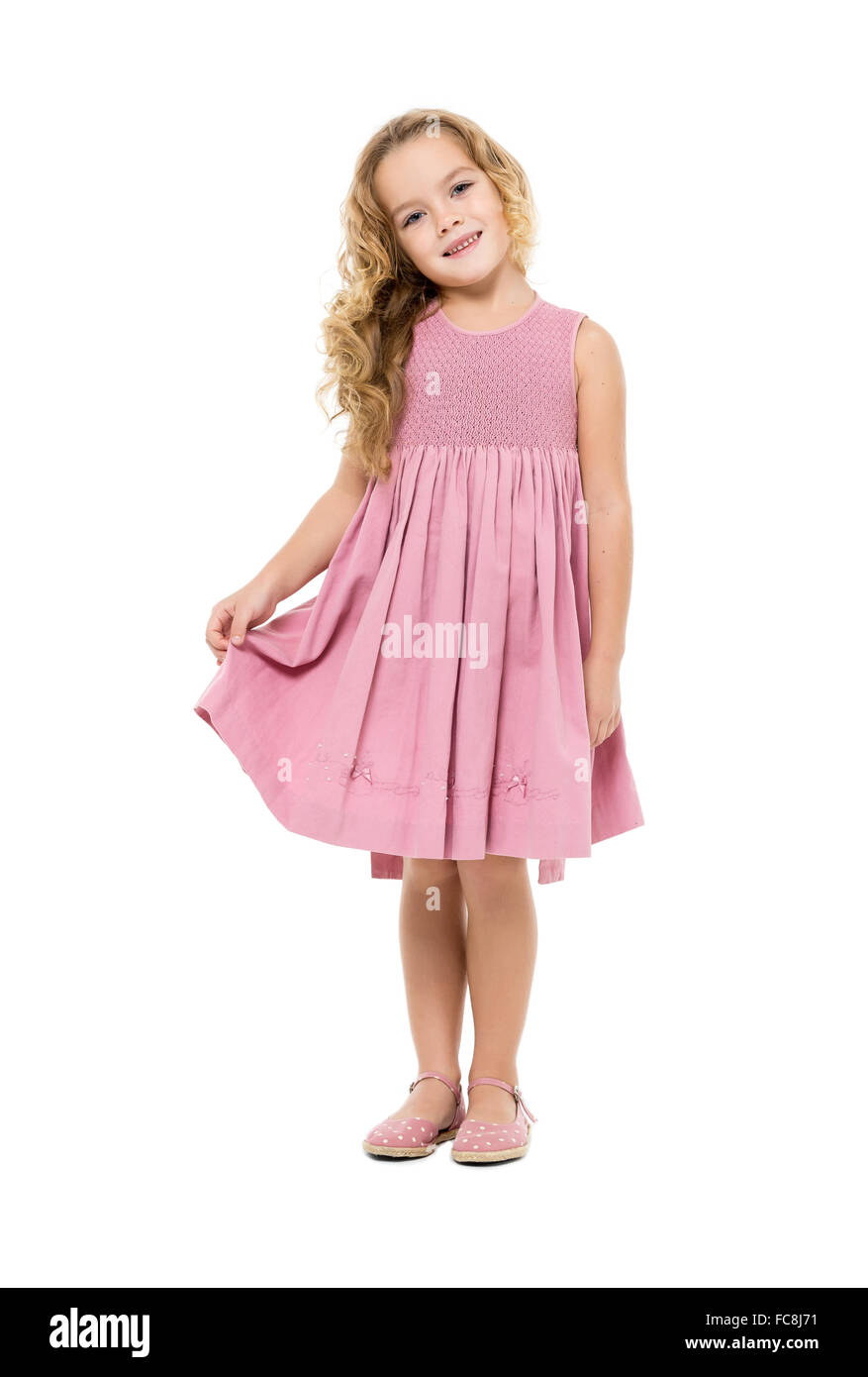 Little Girl in a Pink Dress Posing Stock Photo