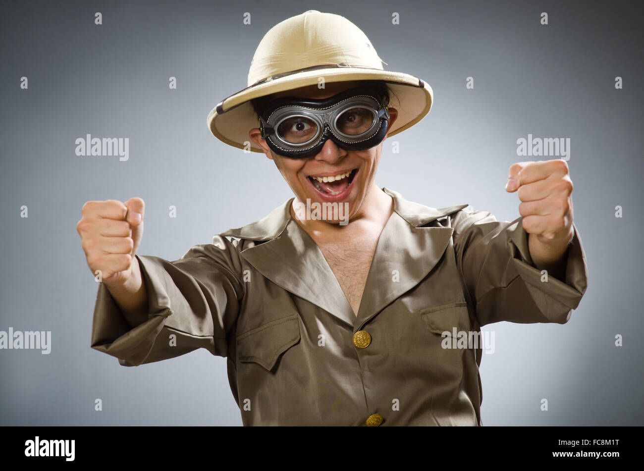 Man wearing safari hat in funny concept Stock Photo - Alamy