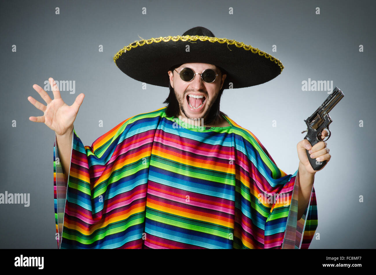 Mexican with gun wearing sombrero Stock Photo Alamy