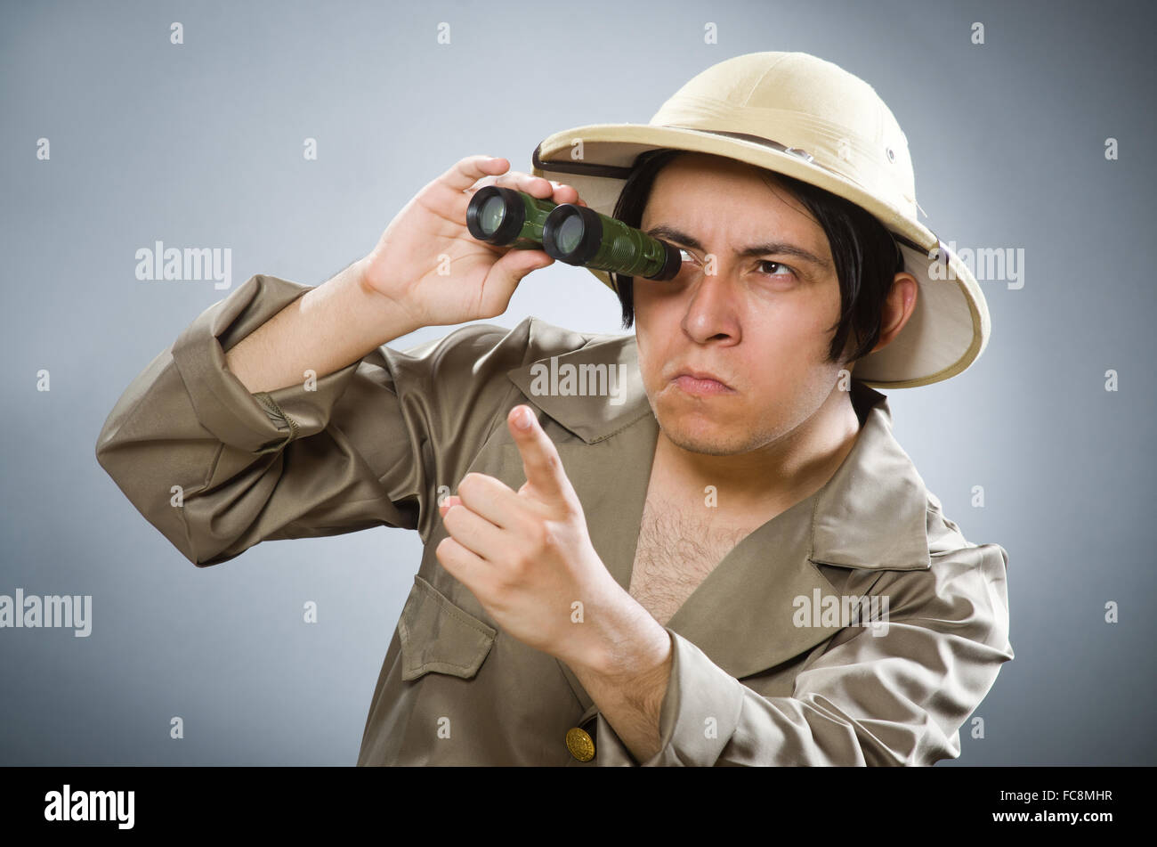 Man wearing safari hat in funny concept Stock Photo - Alamy