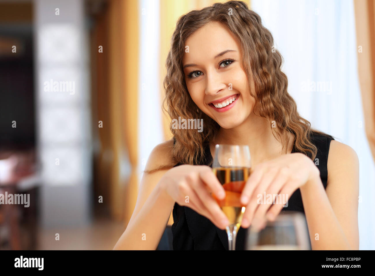 Portrait of a young pretty woman sitting in restaurant Stock Photo - Alamy