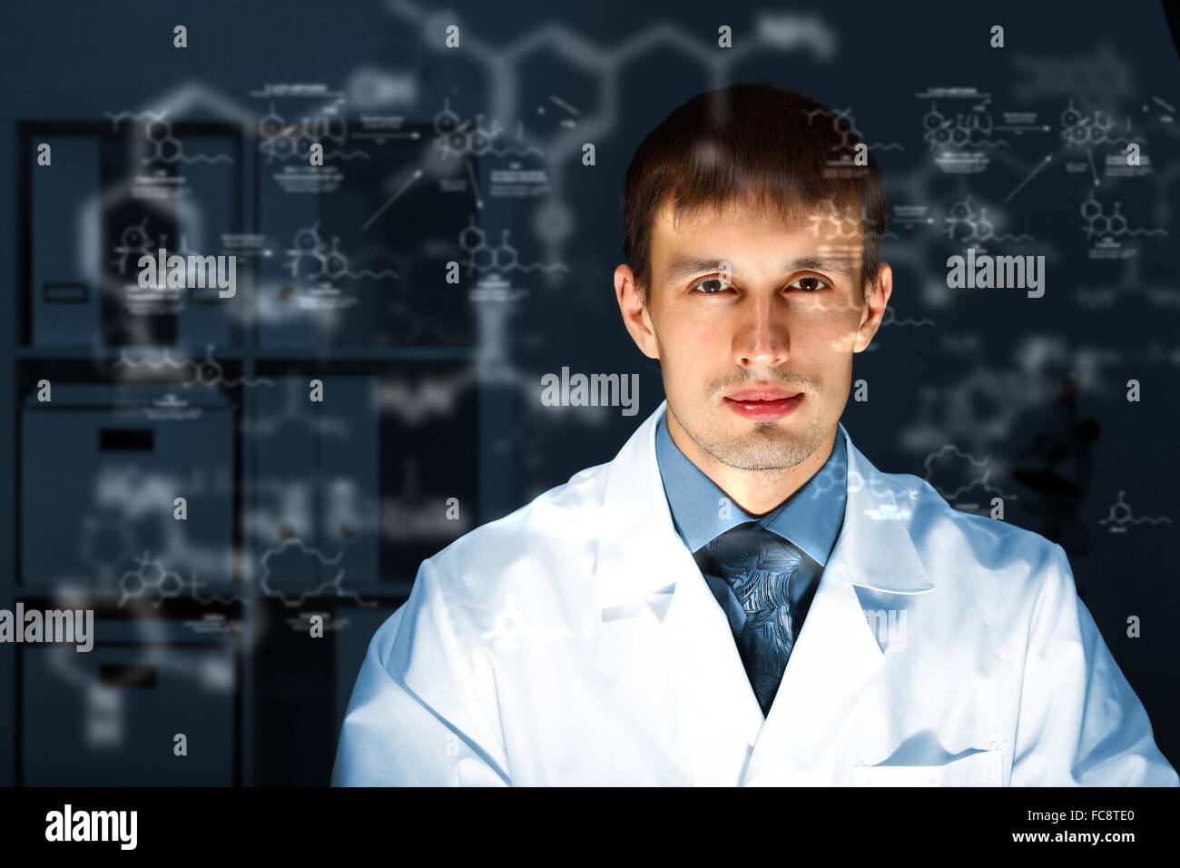 Young chemist in white uniform working in laboratory Stock Photo Alamy