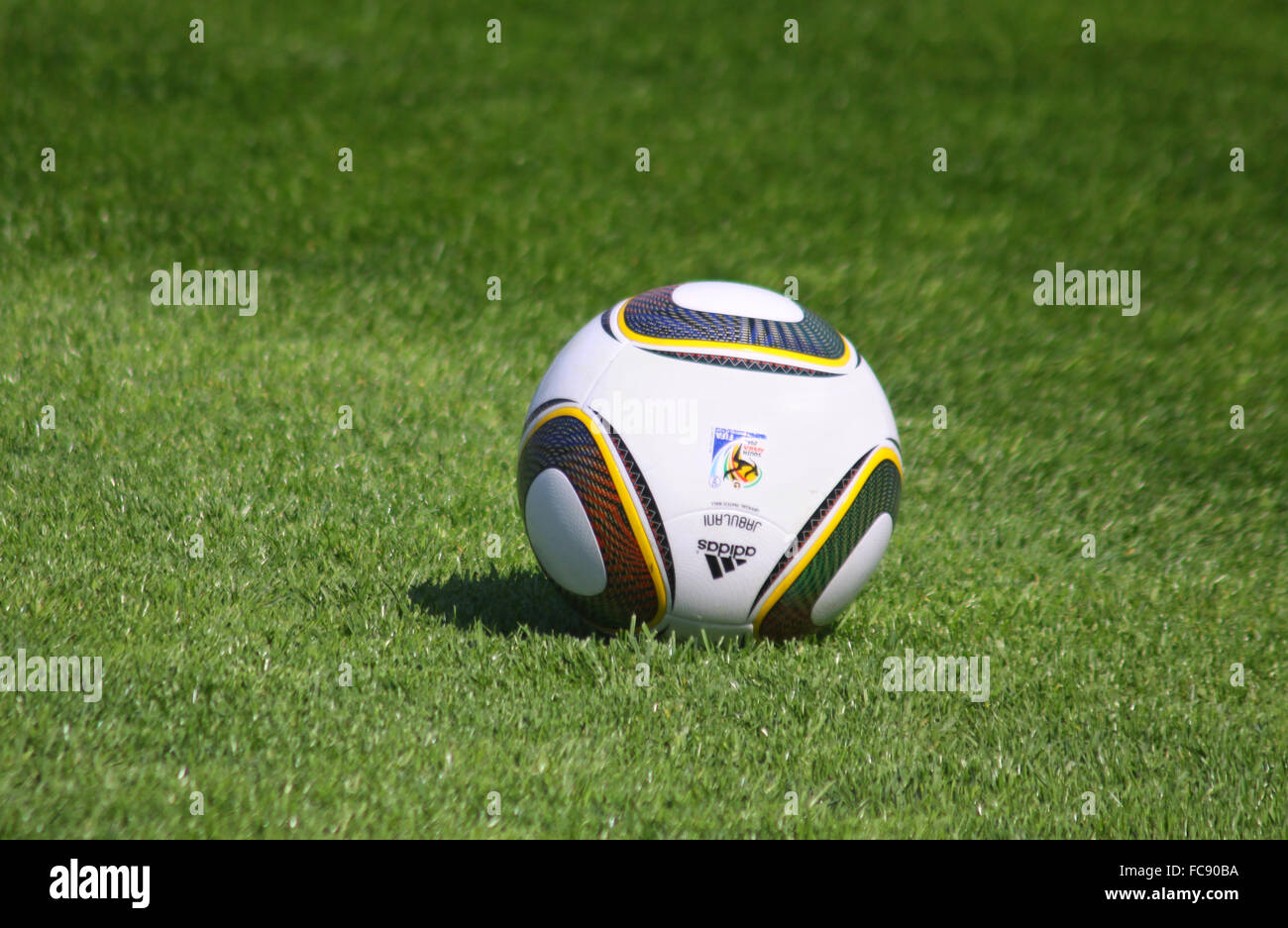 Jabulani soccer ball on the green grass field Stock Photo