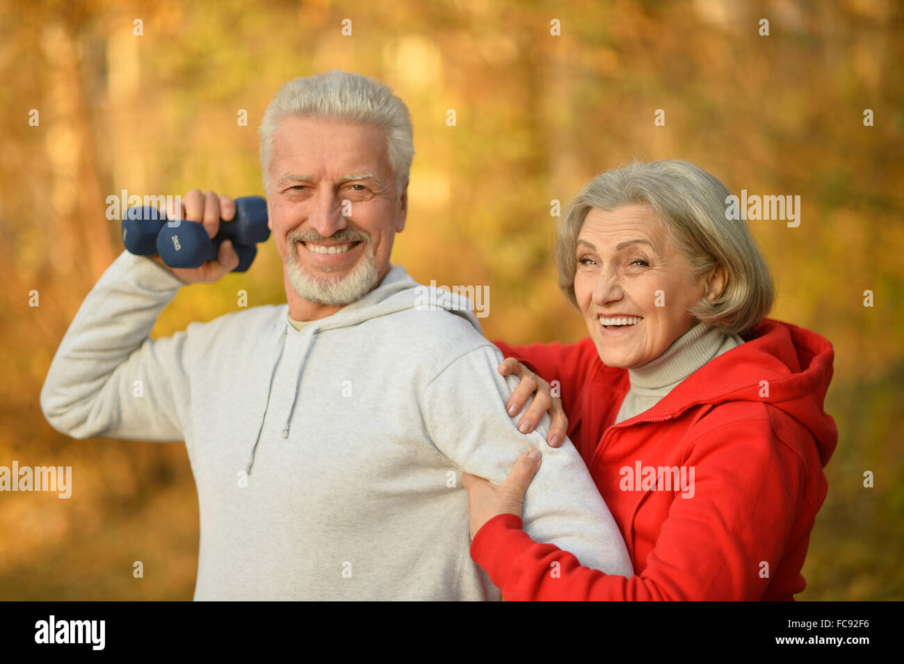 Happy fit senior couple exercising Stock Photo - Alamy