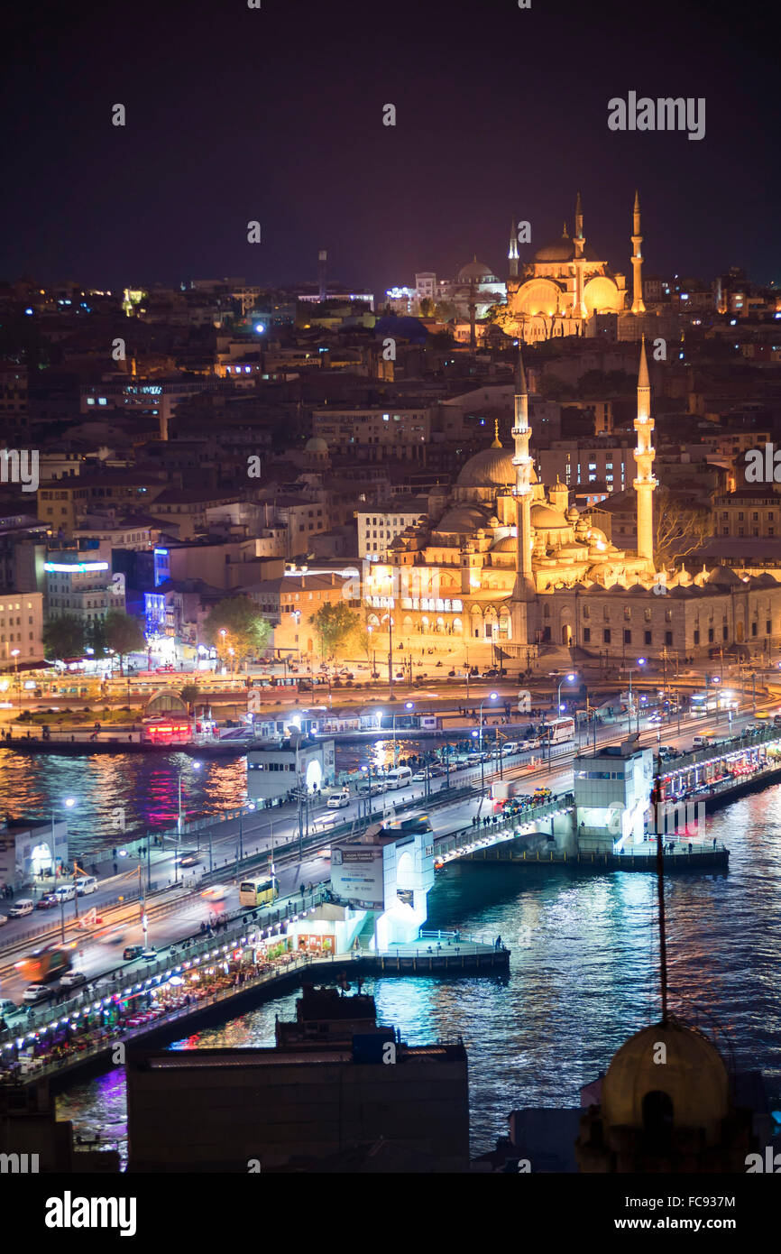 New Mosque (Yeni Cami) and Galata Bridge across Golden Horn at night seen from Galata Tower, Istanbul, Turkey, Europe Stock Photo