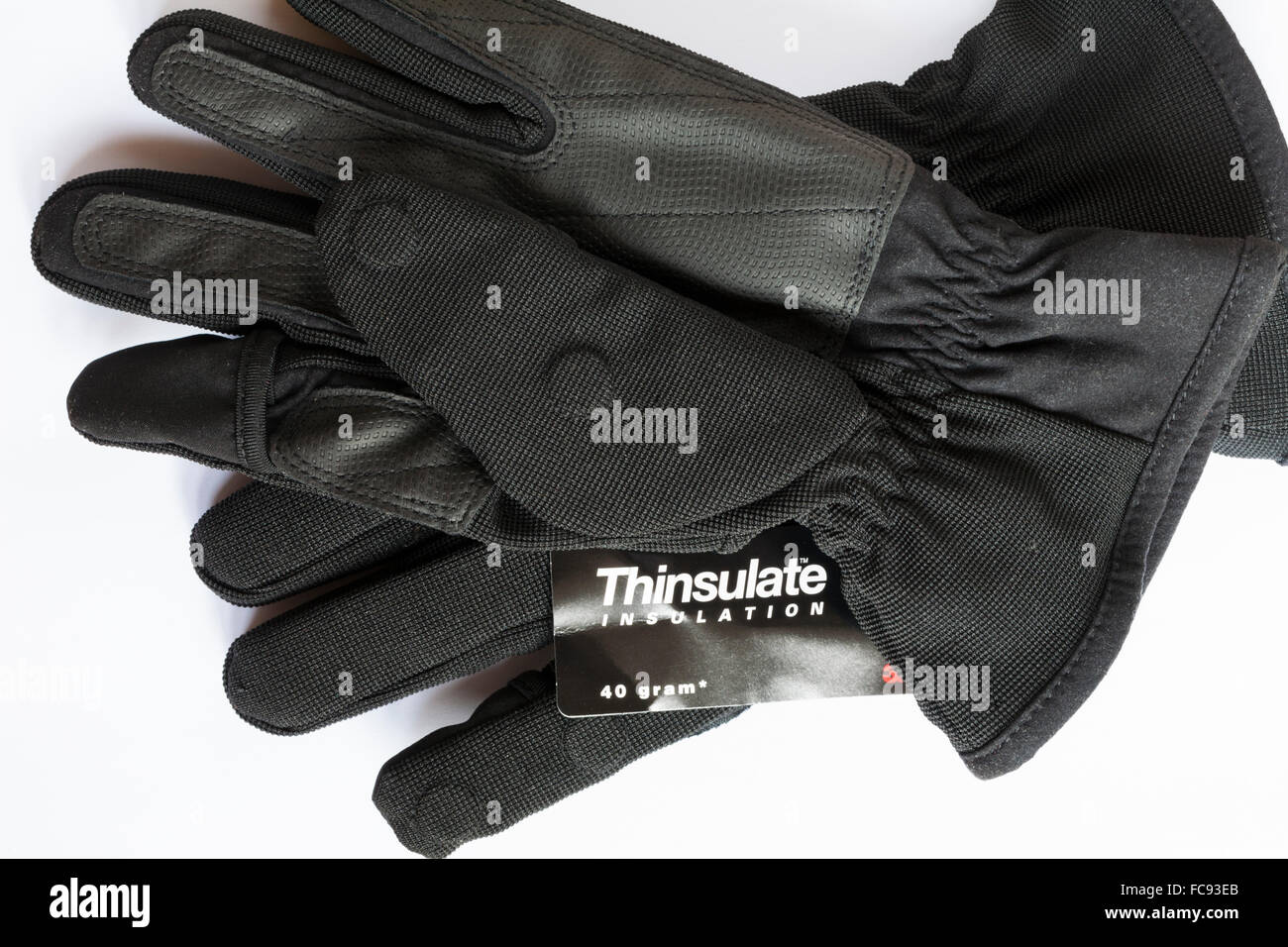 Thinsulate insulation pair of gloves with magnetic fold back fingers set on  white background Stock Photo - Alamy