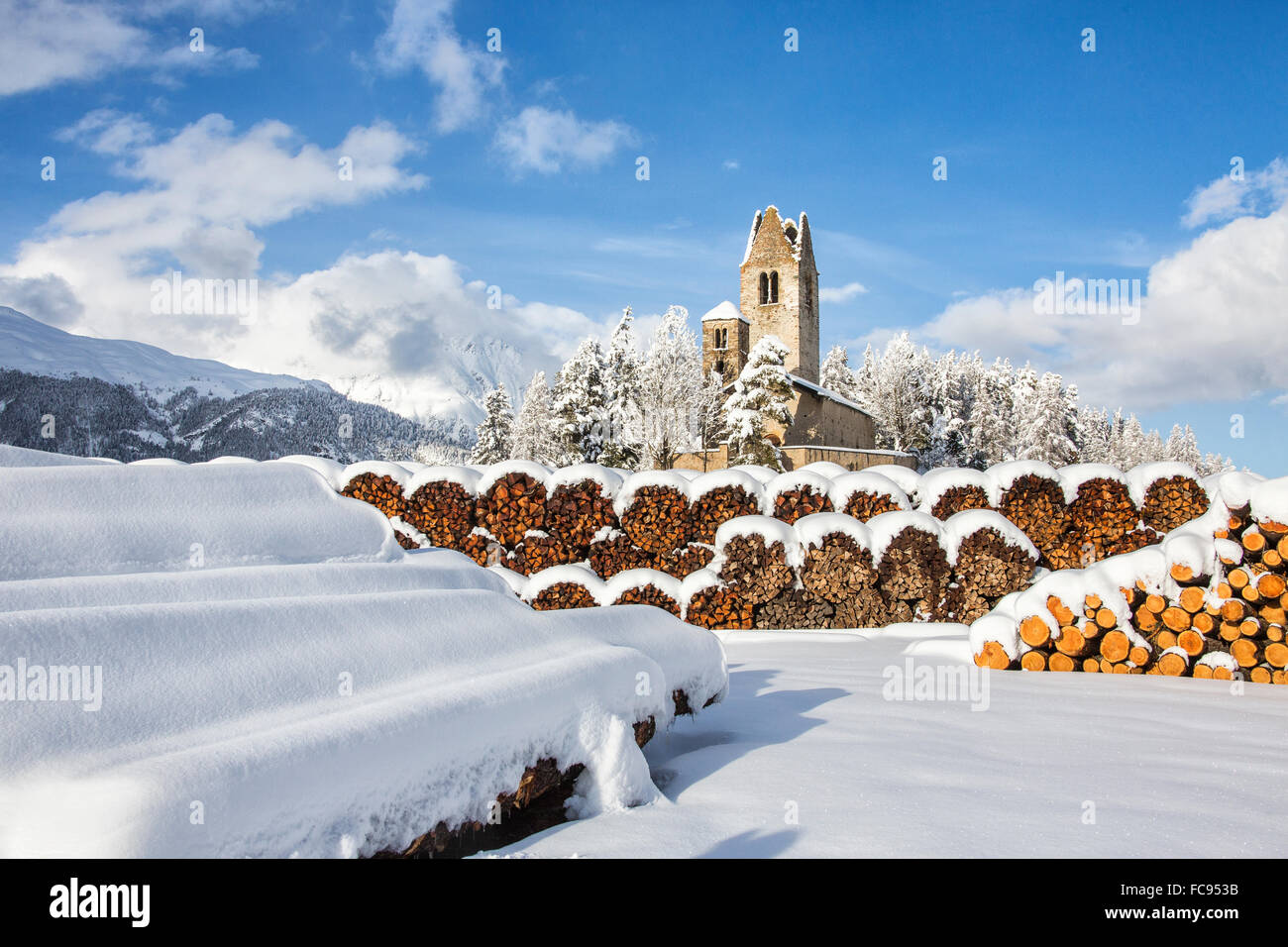 The church of San Gian surrounded by snowy woods, Celerina, Engadine, Canton of Grisons (Graubunden), Switzerland, Europe Stock Photo