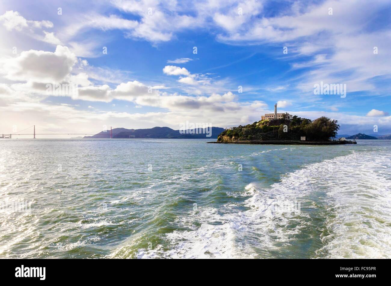 The Alcatraz Penitentiary, now a museum, and the Golden Gate bridge in San Francisco, California, United States of America. A vi Stock Photo