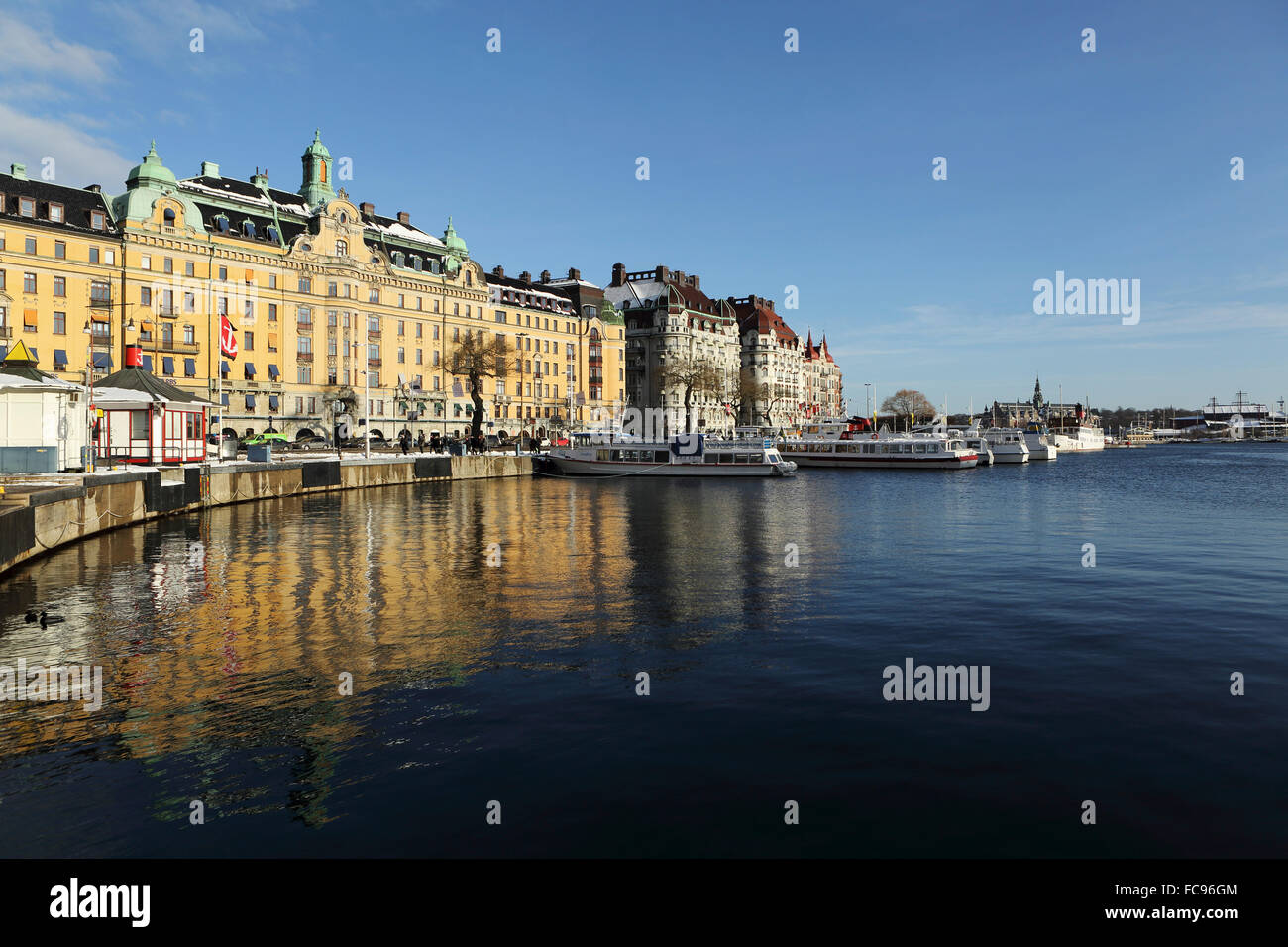 Waterfront buildings at Strandvagen, overlooking boats at Nybroviken, in Stockholm, Sweden, Scandinavia, Europe Stock Photo