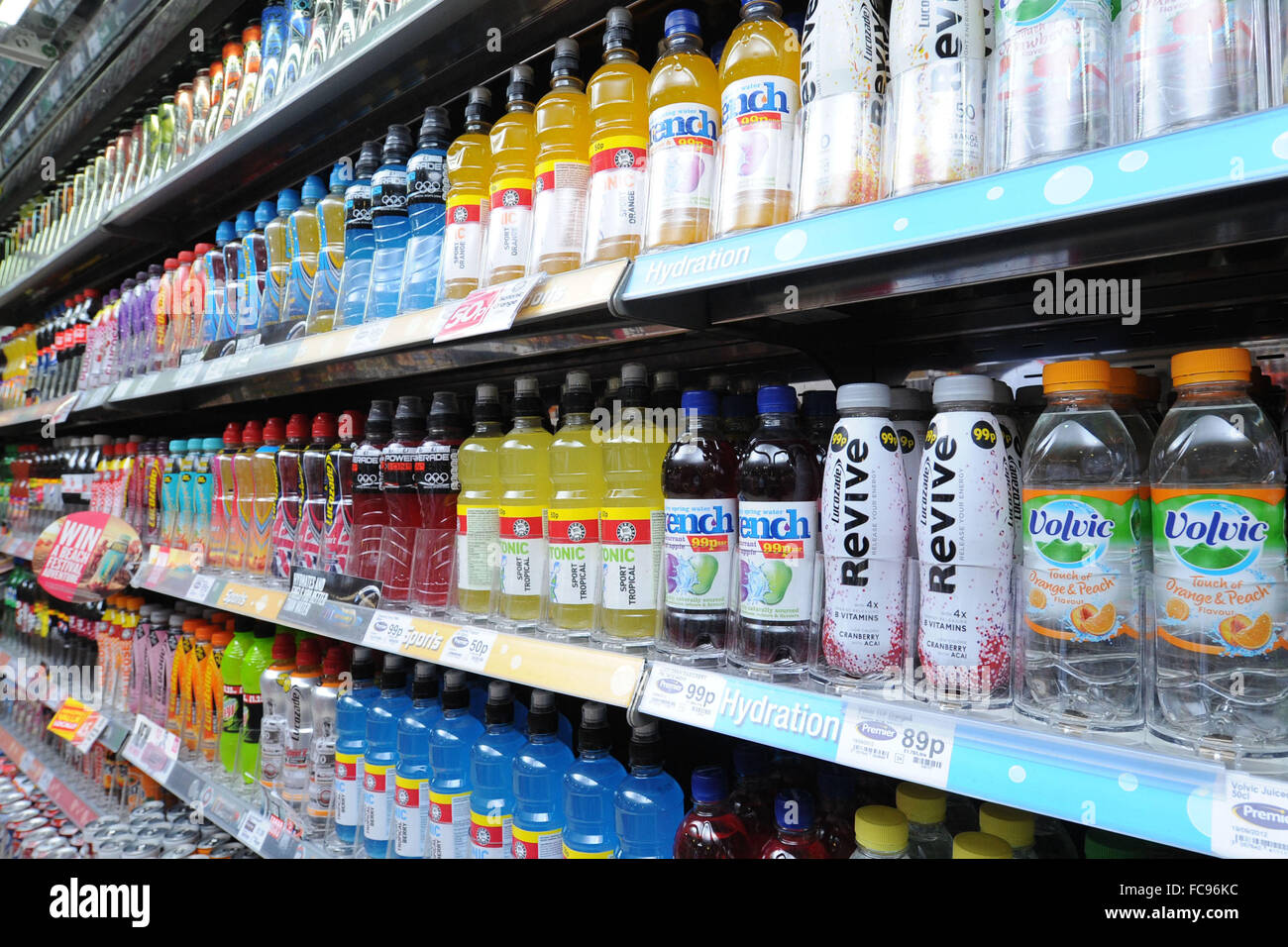 Fizzy carbonated soft drinks for sale in a shop. Sugary fizzy drinks cause diabetes, tooth decay and heart disease. Stock Photo