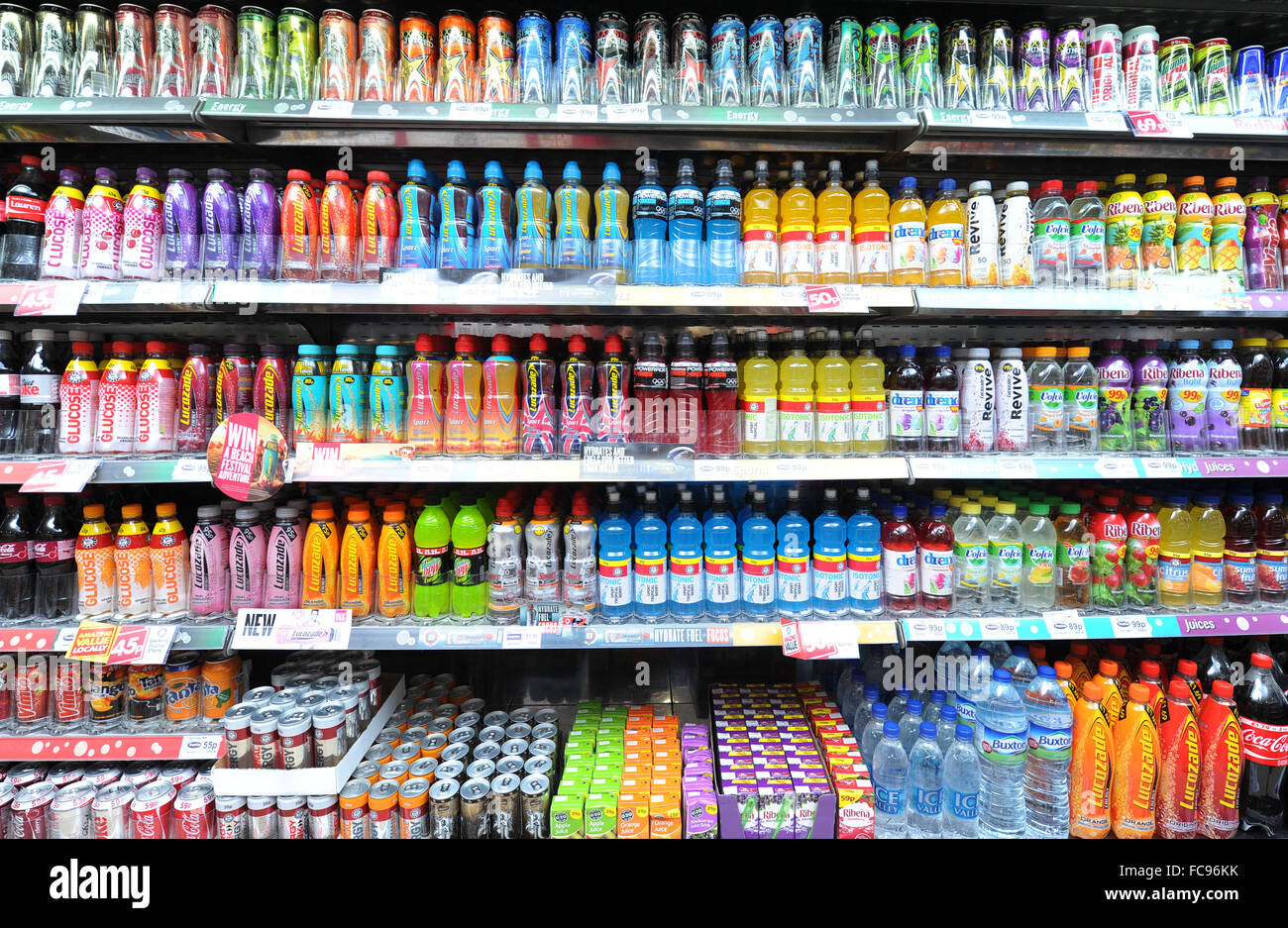 Fizzy carbonated soft drinks for sale in a shop. Sugary fizzy drinks cause diabetes, tooth decay and heart disease. Stock Photo