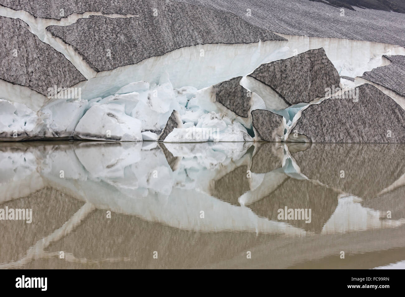 Glacial ice and reflections in small lagoon, Eyjafjallajokull Glacier, Iceland Stock Photo