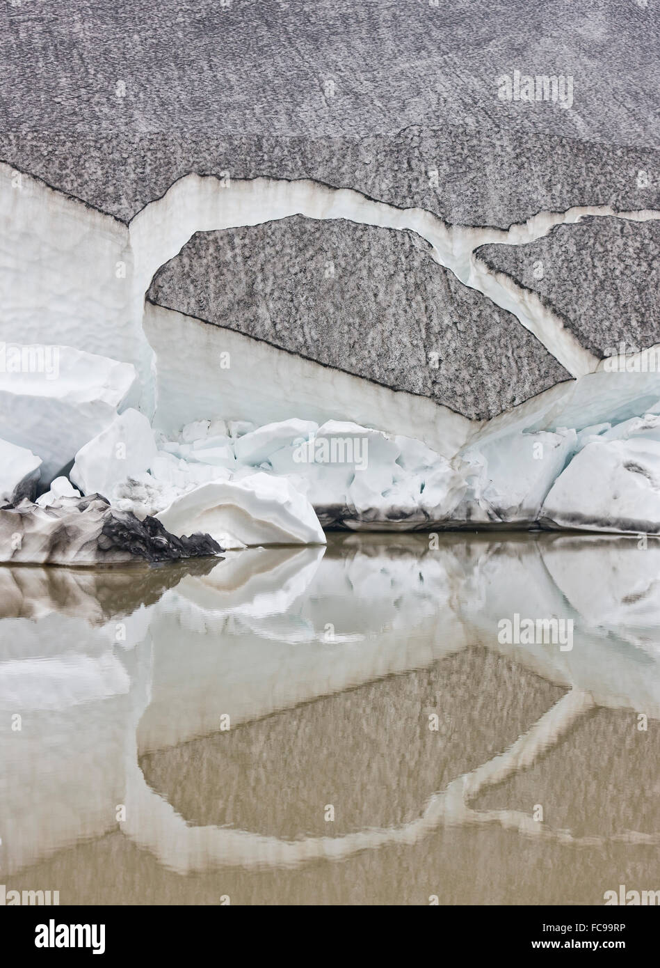 Glacial ice and reflections in small lagoon, Eyjafjallajokull Glacier, Iceland Stock Photo
