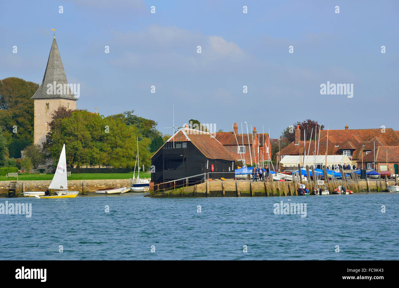 View taken from the water at high tide  of the village of Bosham situated in Chichester Harbour, West Sussex, England (UK) Stock Photo