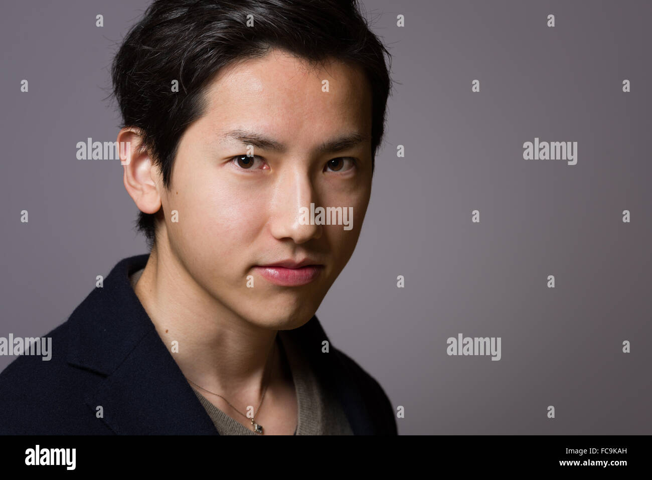 A headshot of a young handsome Japanese man Stock Photo - Alamy