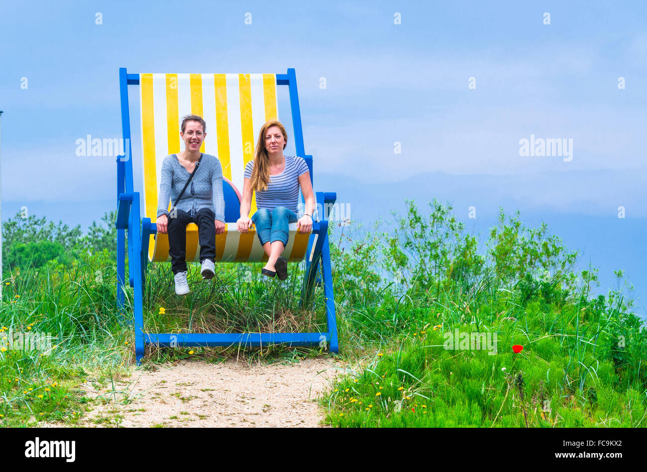 Big deck chair with 2 women Stock Photo Alamy