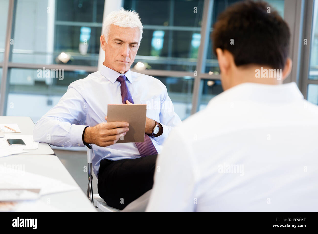 Two men during job interview hi-res stock photography and images - Alamy