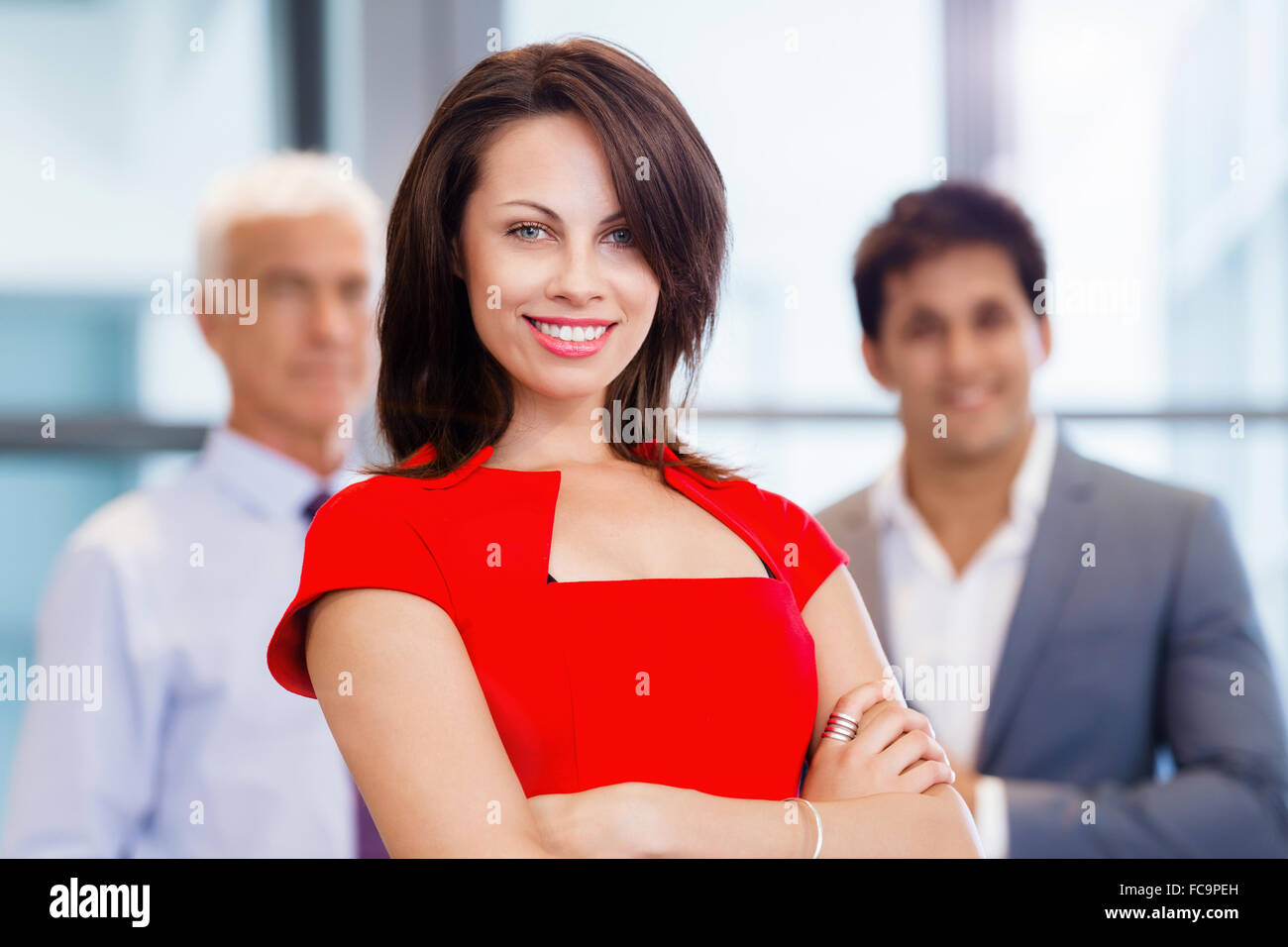 Group of businesspeople in office standing Stock Photo - Alamy