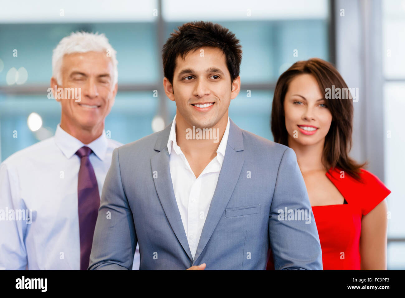 Group of businesspeople in office standing Stock Photo - Alamy