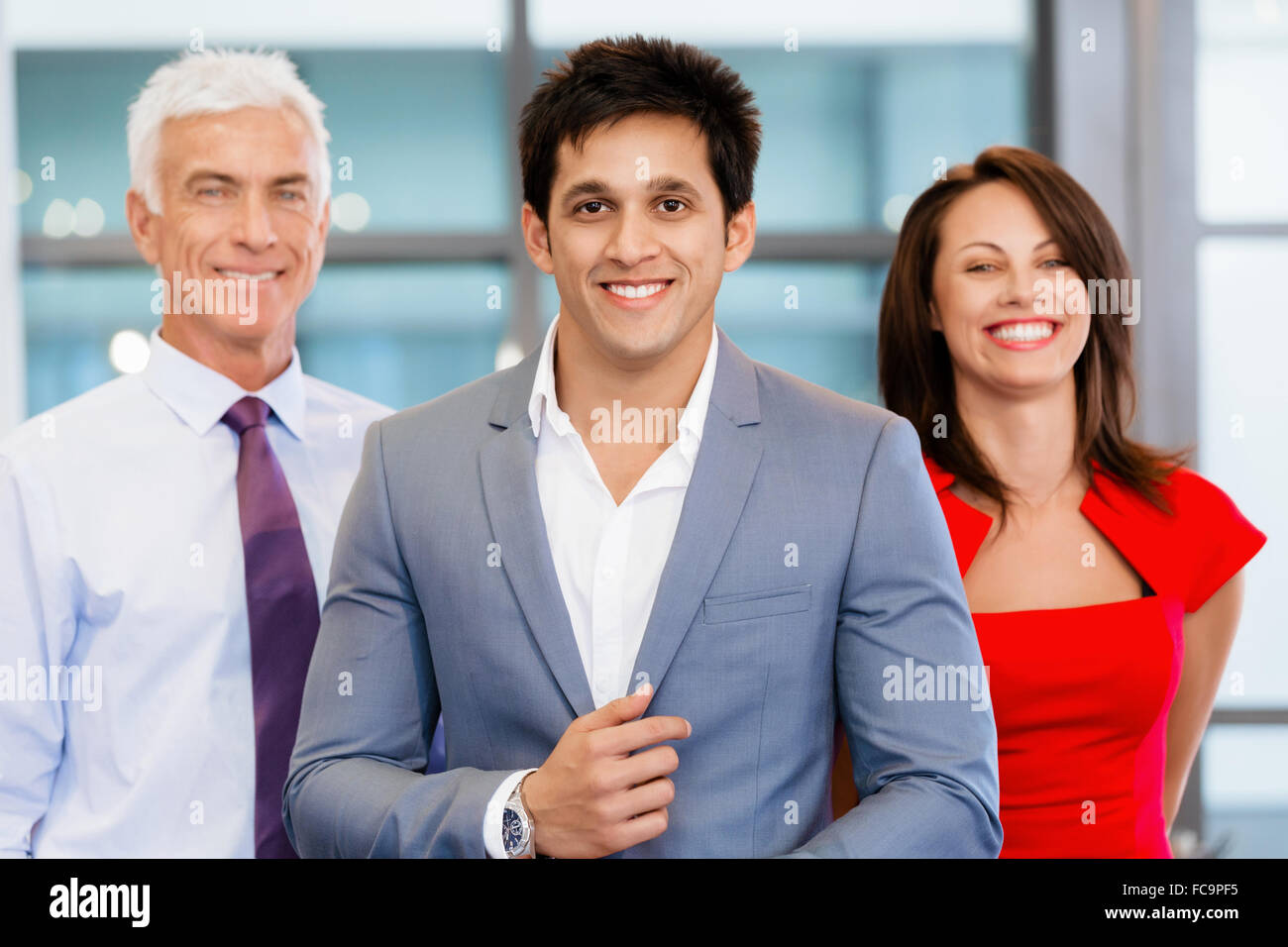 Group of businesspeople in office standing Stock Photo - Alamy