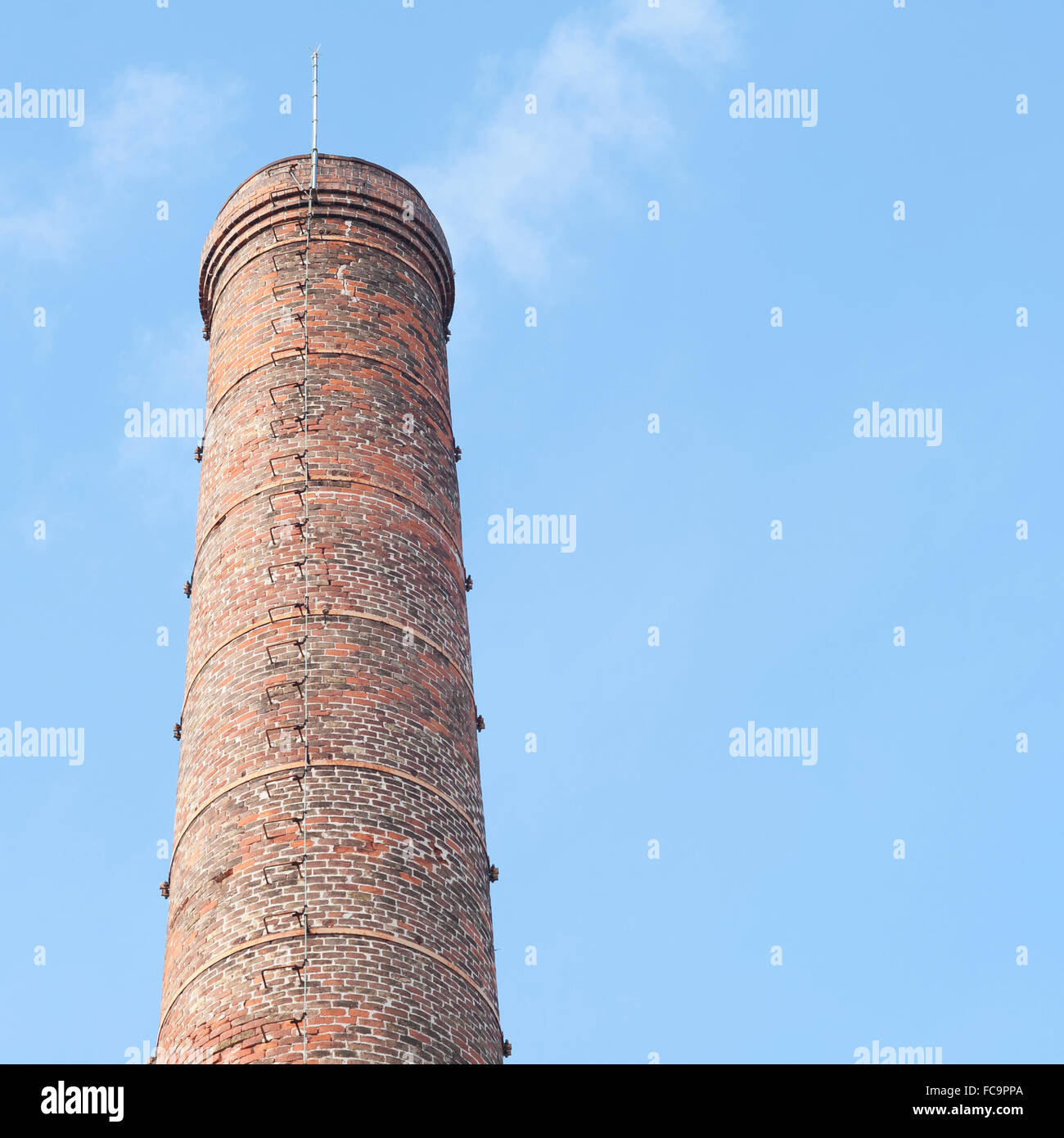 Smokestack of an old abandoned industrial complex Stock Photo