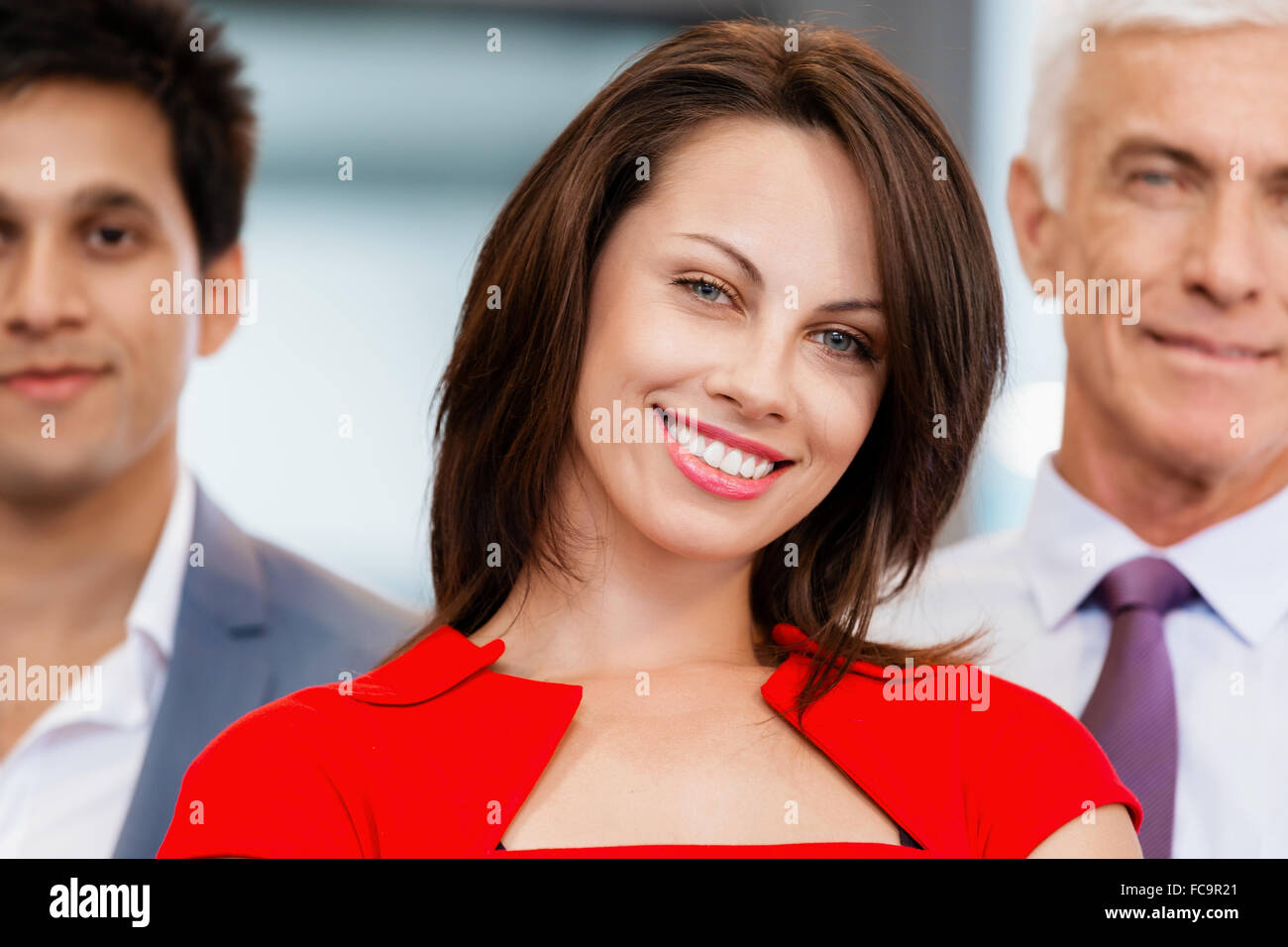 Group of businesspeople in office standing Stock Photo - Alamy