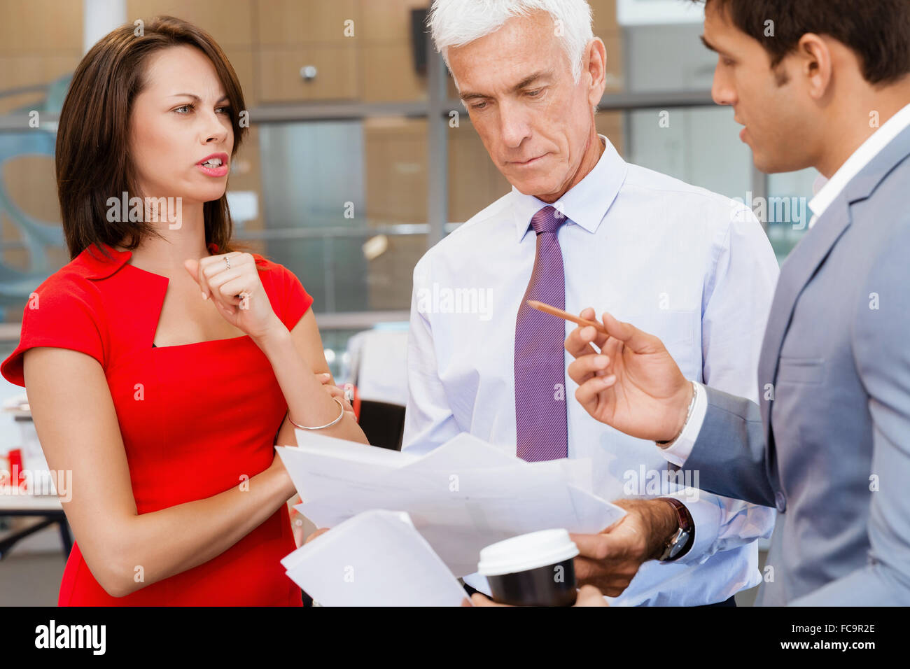 Group of businesspeople in office standing Stock Photo - Alamy