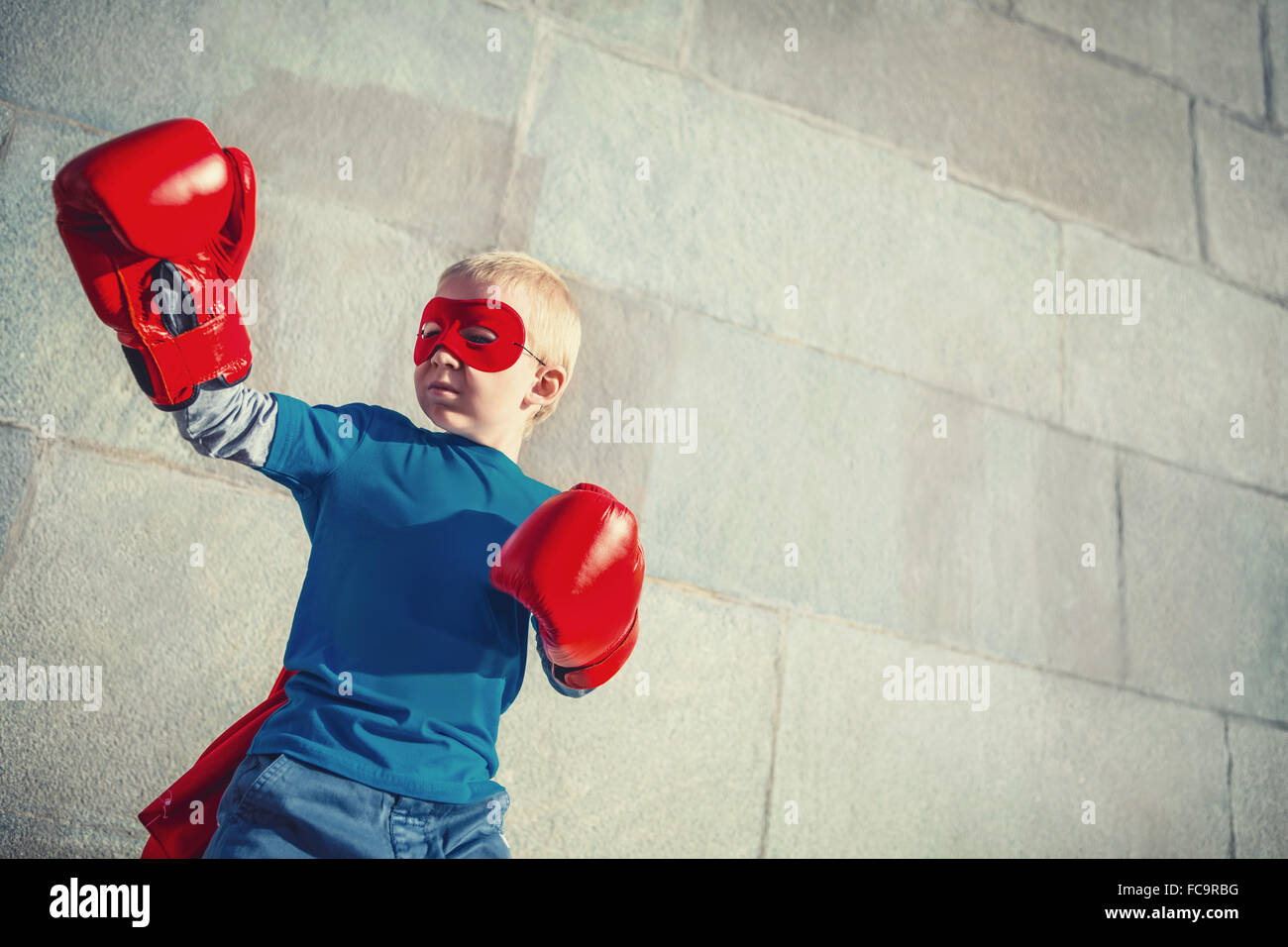 Boy with boxing gloves Stock Photo