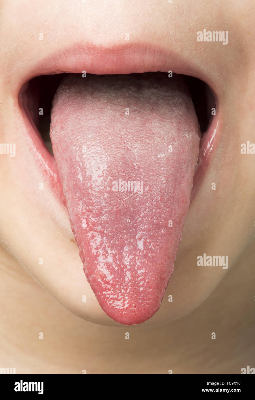 Human tongue protruding out Stock Photo Alamy