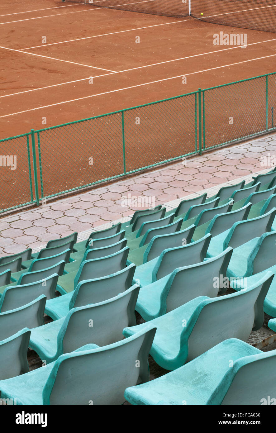 Grandstand seats and tennis court Stock Photo - Alamy